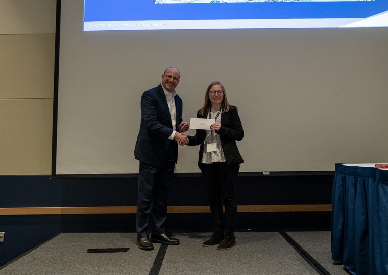 Chris Cerino accepts an award at his alma mater