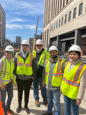 STV team members with University of Illinois Chicago students tour the Harrison Street Viaduct project.
