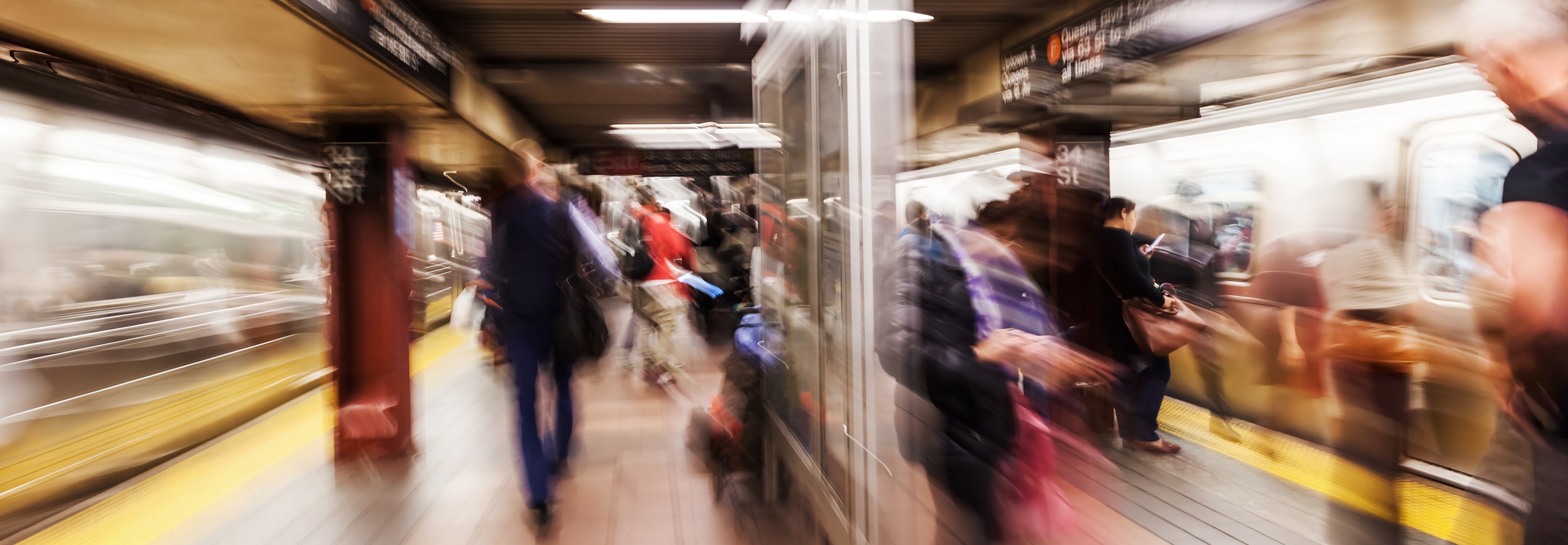 Riders on a subway platform.