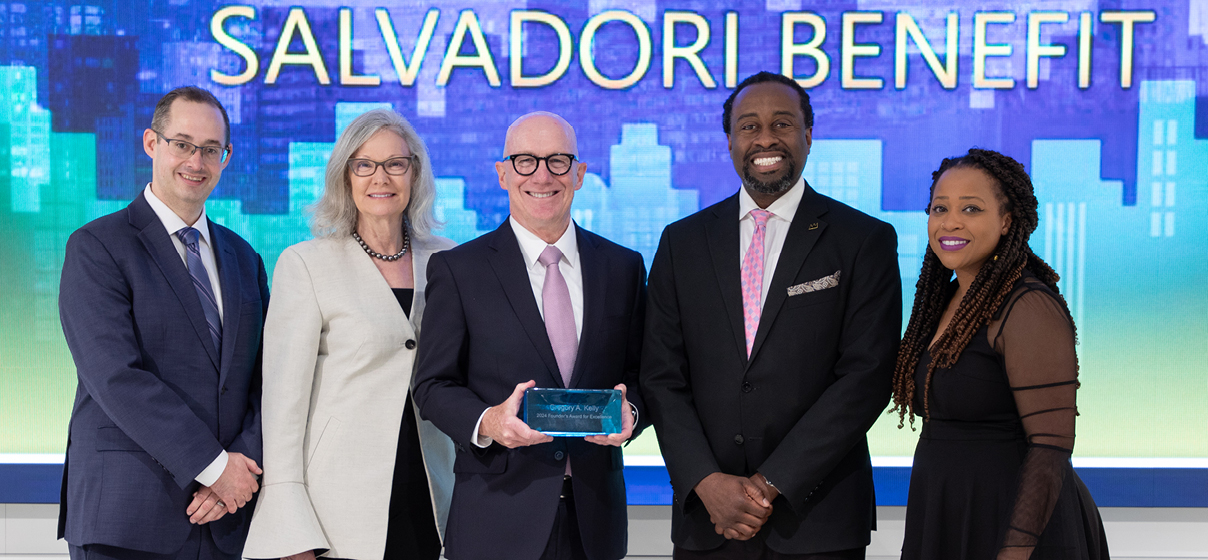 Greg Kelly accepts the Salvadori Center's Award for Business