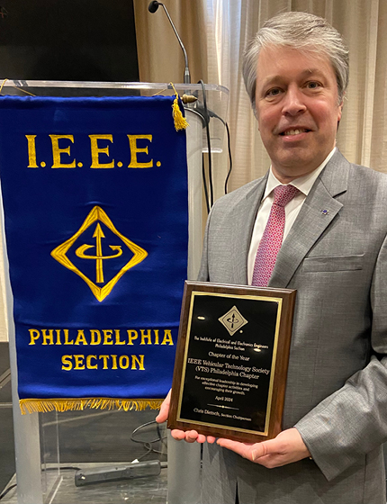 Brandon Swartley accepts his awards from IEEE Philadelphia