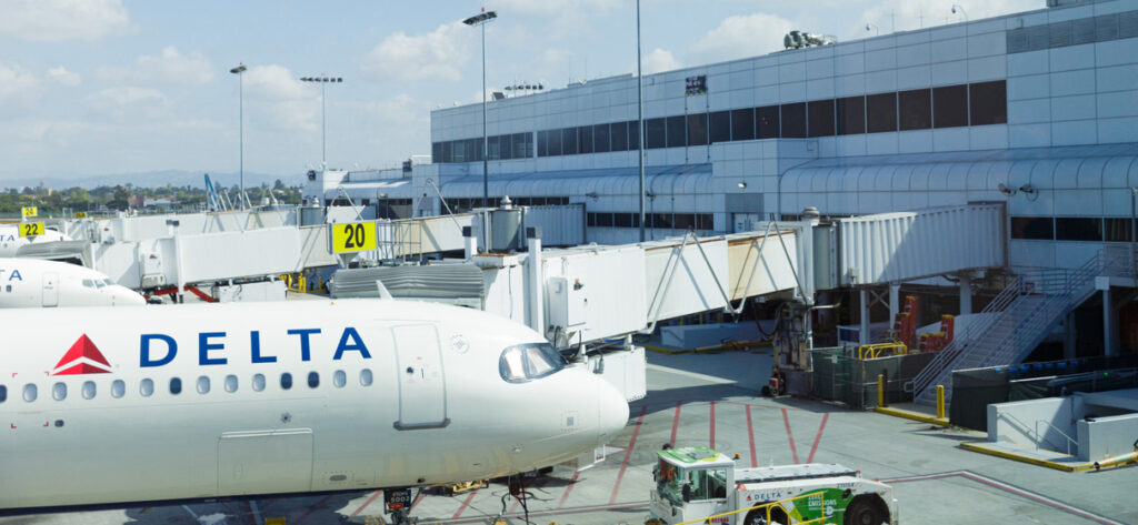 Delta Airlines planes wait at their gates