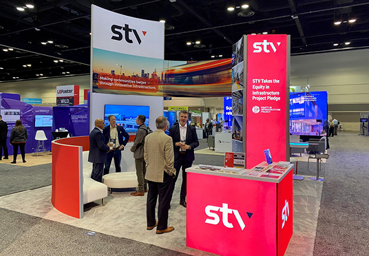 STV staff meet with attendees at a conference