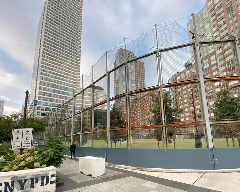 The Battery Park fields from the street corner