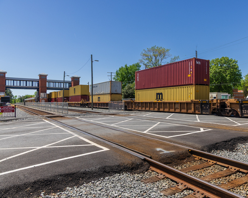A freight train leaves Quantico Station.