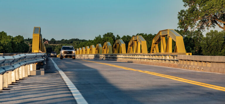 Cars drive across the Bridgeport Bridge on historic Route 66, now US 281, in Oklahoma.