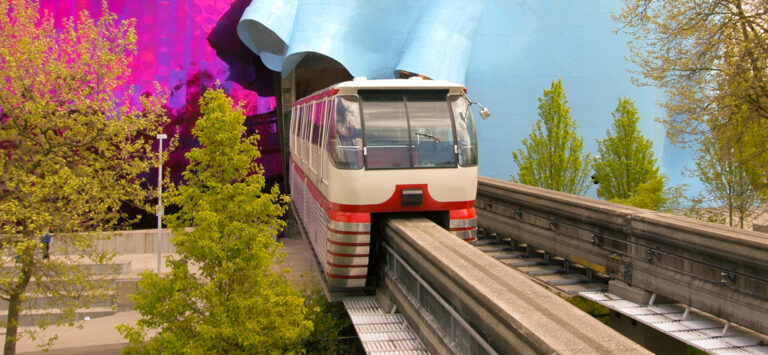 The Seattle Center Monorial train running through the Museum of Pop Culture.