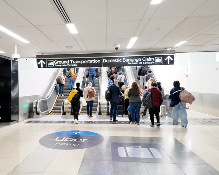 Passengers go up the escalators at Hartsfield-Jackson Atlanta International Airport's Plane Train Tunnel.