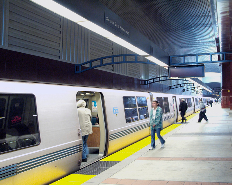 Passengers board a BART train.