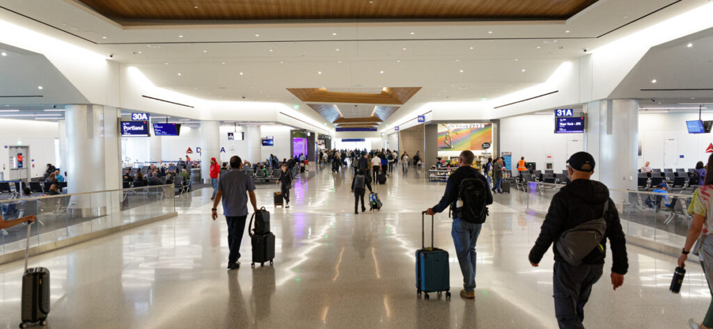 Passengers walk through the new Delta terminal at LAX.