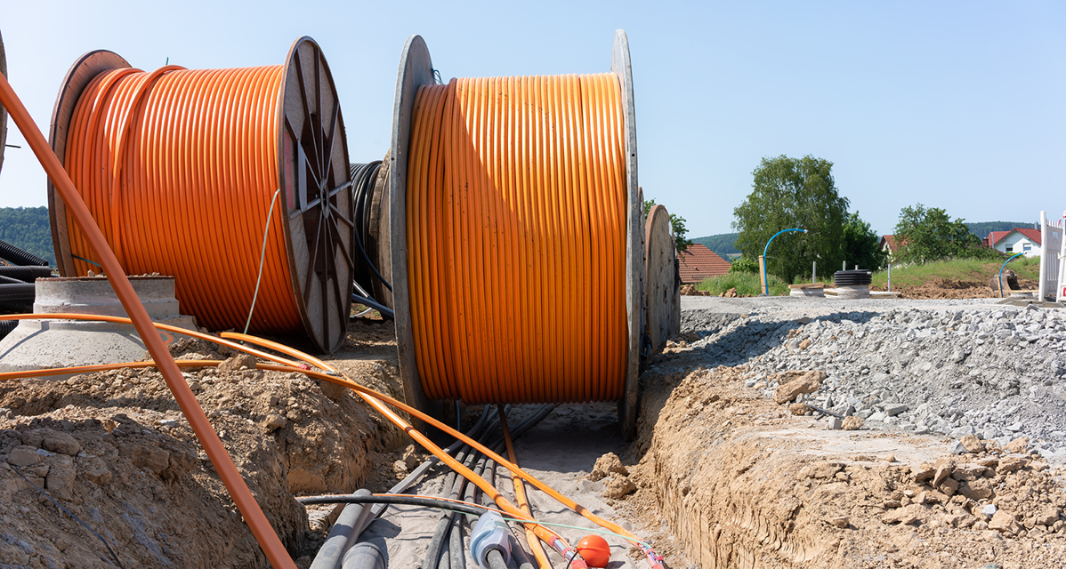 Cables being laid into a channel.