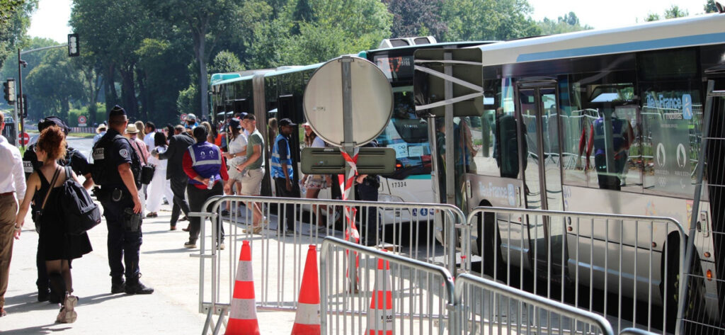 Shuttle busses wait to take spectators to the 2024 Olympic Games.