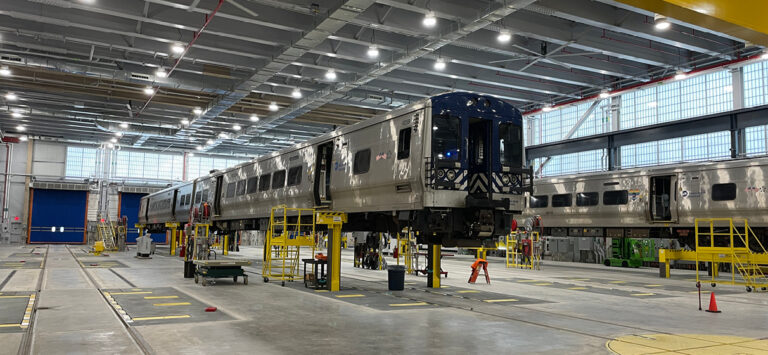 Metro-North Railroad vehicle on inspection lifts inside of recently updated Harmon Shop in Croton-on-Hudson, NY