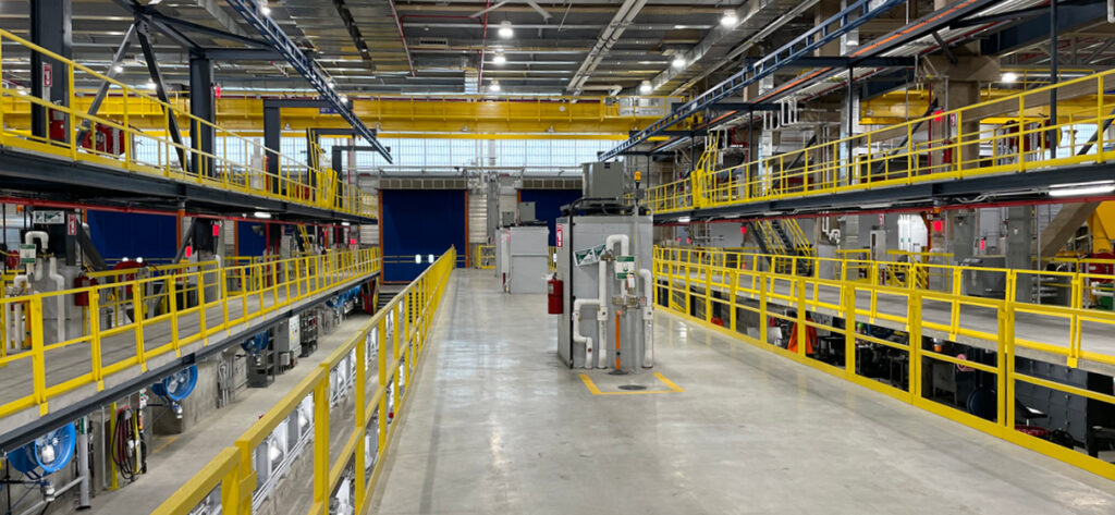 Interior view of new Metro-North Railroad Harmon Shop showcasing service bay for Metro-North vehicle