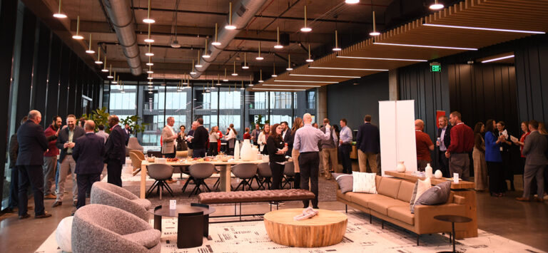 STV staff and clients mingle during an open house event at the new STV Charlotte office.