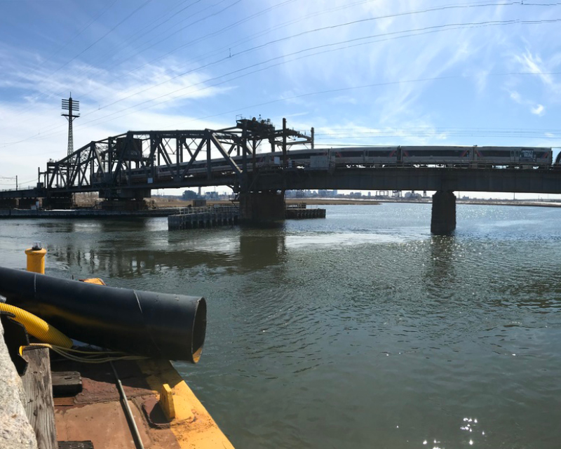 A train crosses the original Portal North Bridge