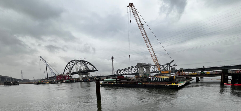 A view of the first tied-arch installation for the Portal North Bridge project highlighting structural progress.