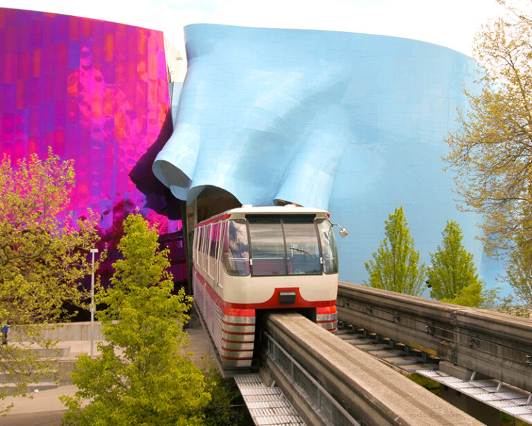 The Seattle Center Monorial train running through the Museum of Pop Culture.