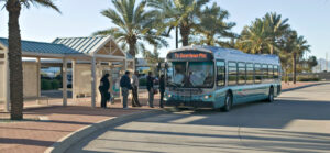 A bus picks up passengers in Phoenix.