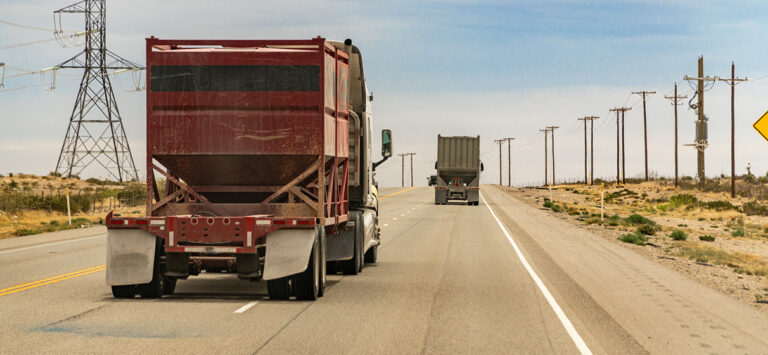 Trucks driving through the Permian Basin fracking area.