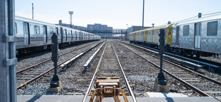 NYC Transit subway trains inside a maintenance facility.
