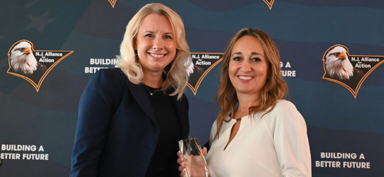 Kim Vierheilig receives an award from the NJ Alliance of Action from event chair Lisa Ballerini.