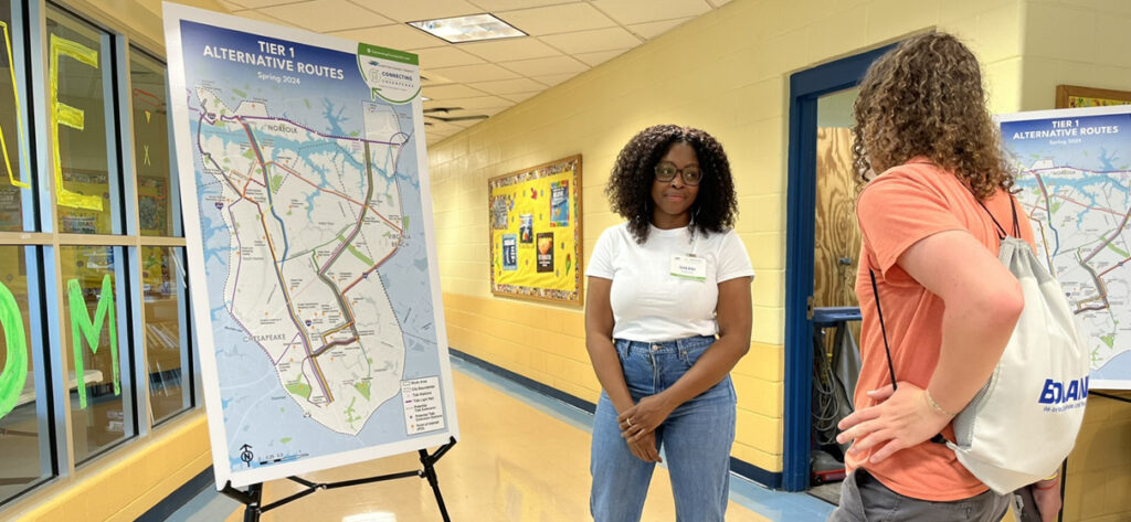 Hampton Roads Transit project manager Sherri Dawson speaks with an attendee at a Connecting Chesapeake community pop-up event.