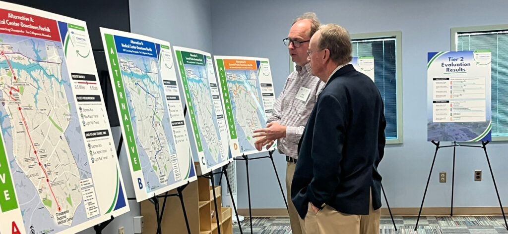 STV’s Eric Nelson (left) speaks with an attendee during a Connecting Chesapeake public meeting in January 2025.