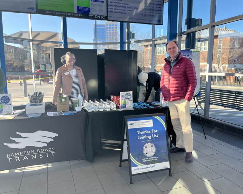 STV’s Eric Nelson stands next to Hampton Roads Transit project manager Sherri Dawson at a Connecting Chesapeake community pop-up event held at the Downtown Norfolk Transit Center.