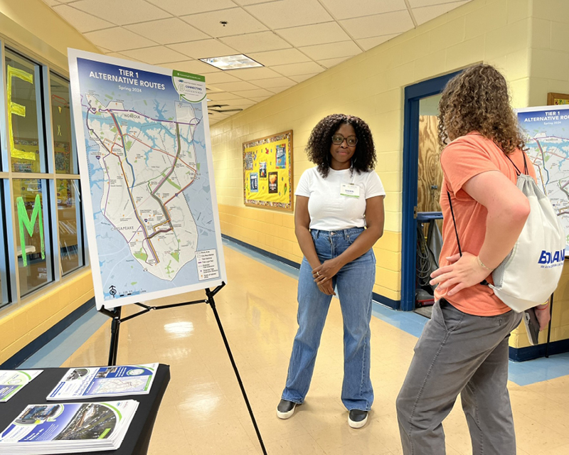 Hampton Roads Transit project manager Sherri Dawson speaks with an attendee at a Connecting Chesapeake community pop-up event.
