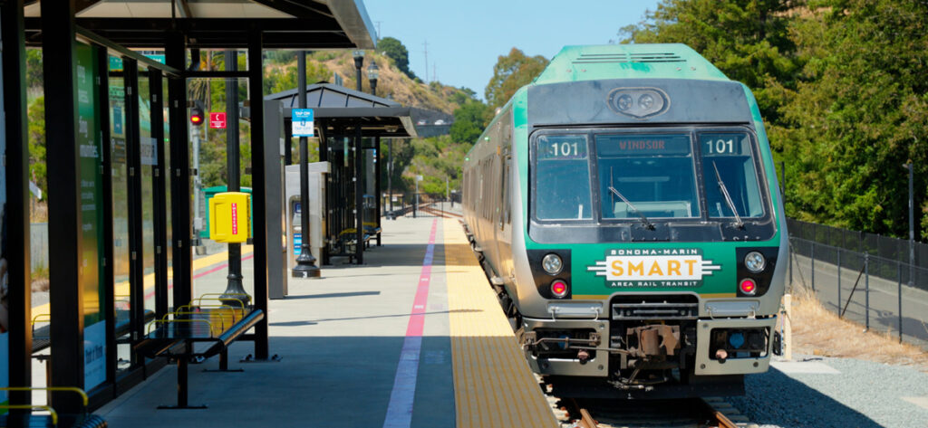 A SMART commuter rail train pulls into a station along the Windsor extension in California.