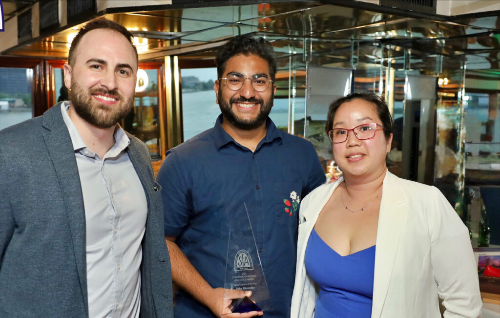 STV’s Jithu Alexander stands holding his award between SEAoNY President Christina Chu-Garcia and President-Elect Anthony Piderit.