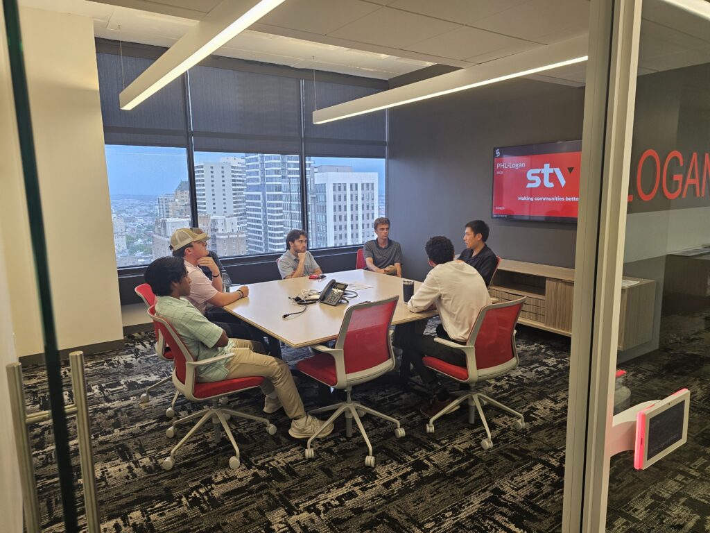 Transportation interns meet inside STV's Philadelphia office to discuss participation in TQI's Shared Interns Program