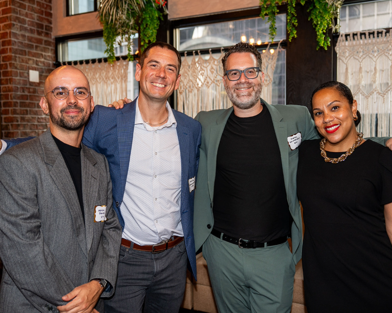 group photo of four people from STV’s Communications team celebrating awards at SMPS NY