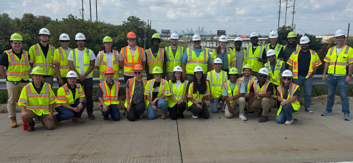 Group photo from a construction site detailing participants and mentors in the TQI Shared Intern Program in Pennsylvania