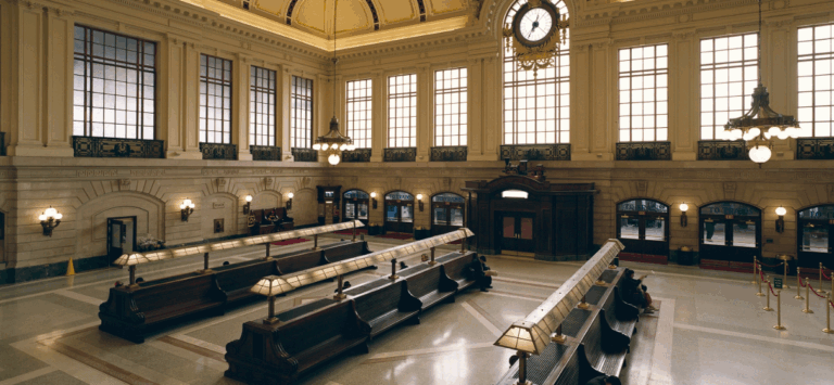 Interior view of the Hoboken Ferry Terminal waiting room showcasing both historic preservation and modern amenities