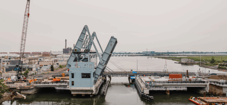 Straight on view of Belden Bly Drawbridge in Massachusetts in open position.
