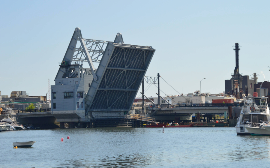 View of Belden Bly Drawbridge in Massachusetts in open position from the water.