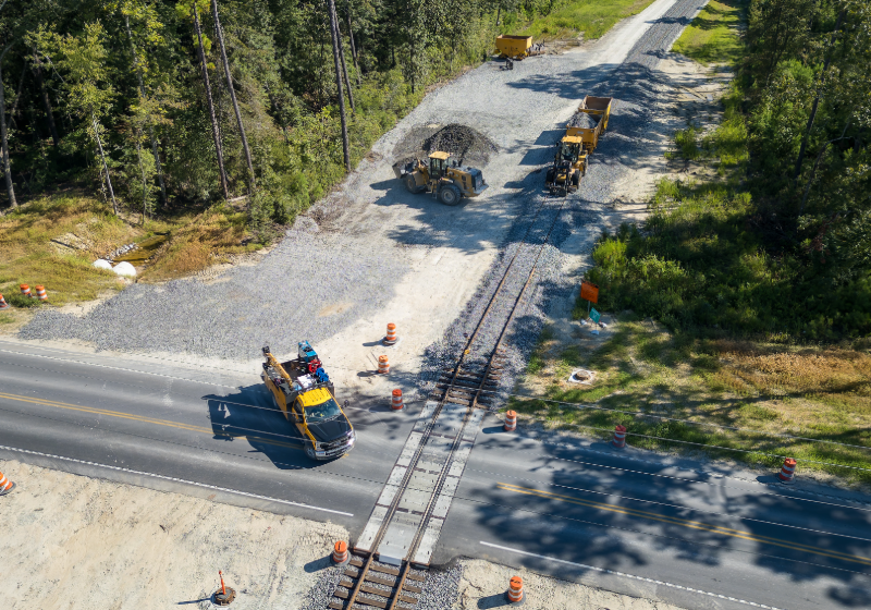 Aerial view of construction crews working on right-of-way/intersection for roadway and freight corridor for the future Camp Hall Rail Connection in South Carolina.