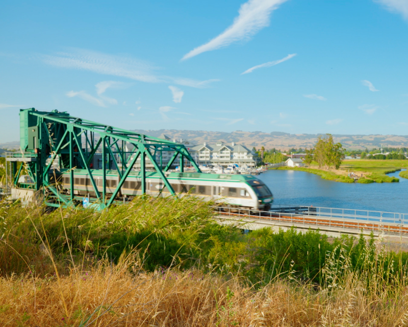 A SMART train crosses a bridge along the Windsor Extension.