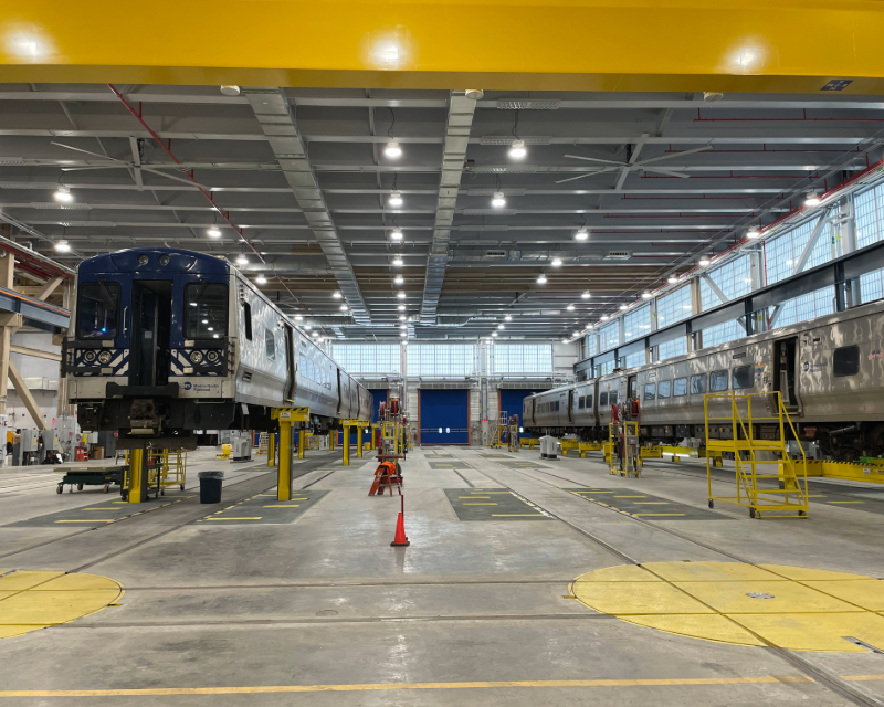 Two Metro-North Railroad trains awaiting service at the Harmon Shop.