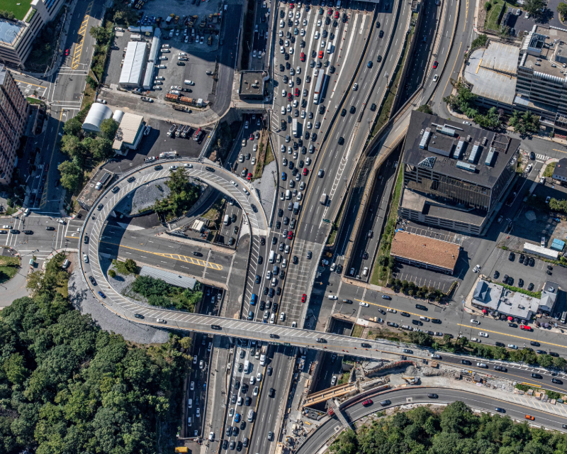 Overhead of vehicles exiting Palisades Interstate Parkway Helix ramp.
