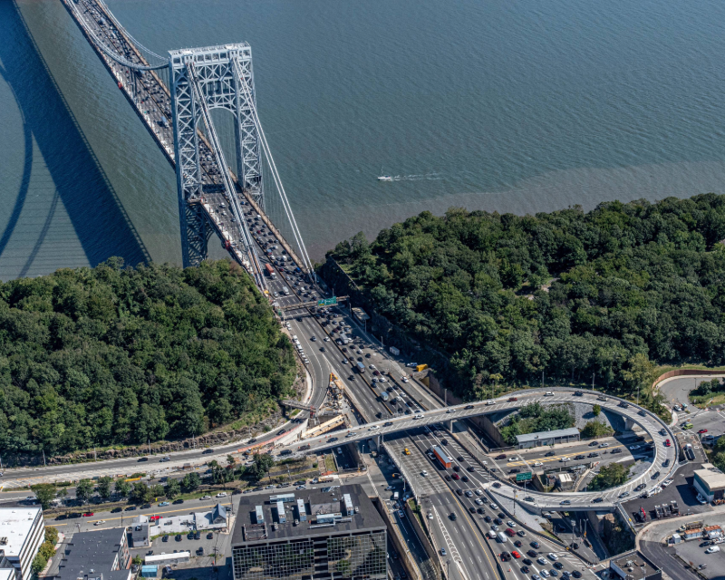 Aerial of Palisades Interstate Parkway Helix ramp with George Washington Bridge in the background.