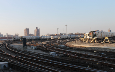 NYC skyline with subway car and tracks