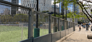 Battery Park field with black fence
