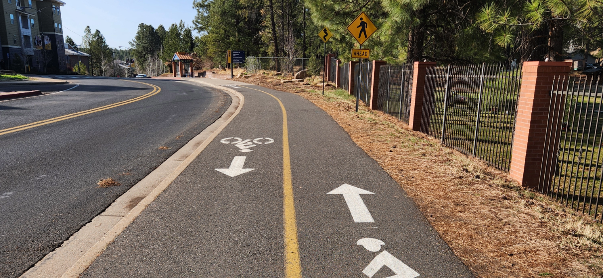 Shared roadway and bikeway with bike lanes with painted markings.
