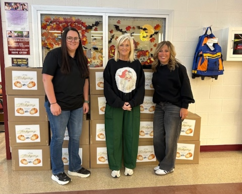 three women participating in the KY food drive