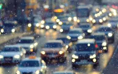 Out of focus cars in snowy traffic
