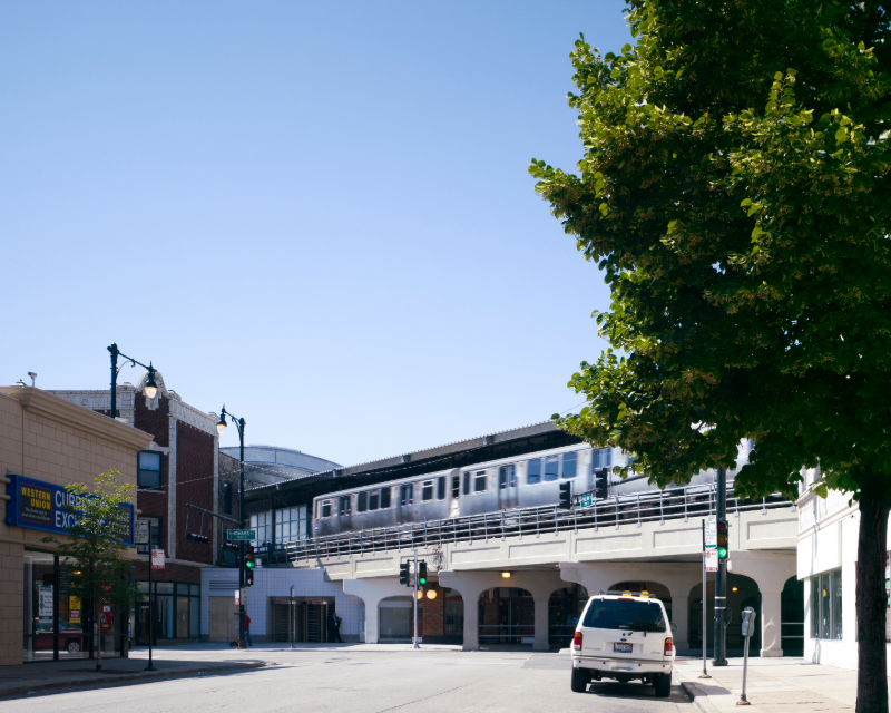 Elevated track viaduct with CTA train at Howard Station in Chicago.