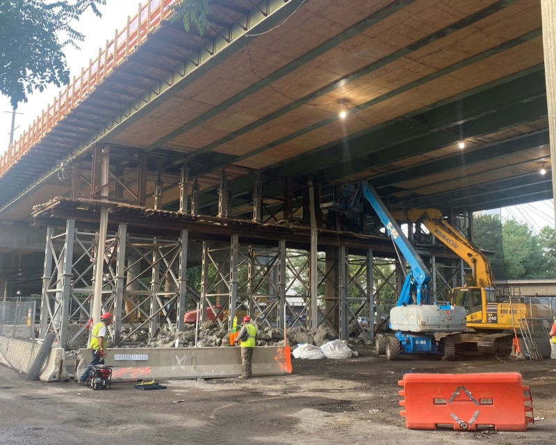 Concrete pier demolition under the Van Wyck Expressway Viaduct.